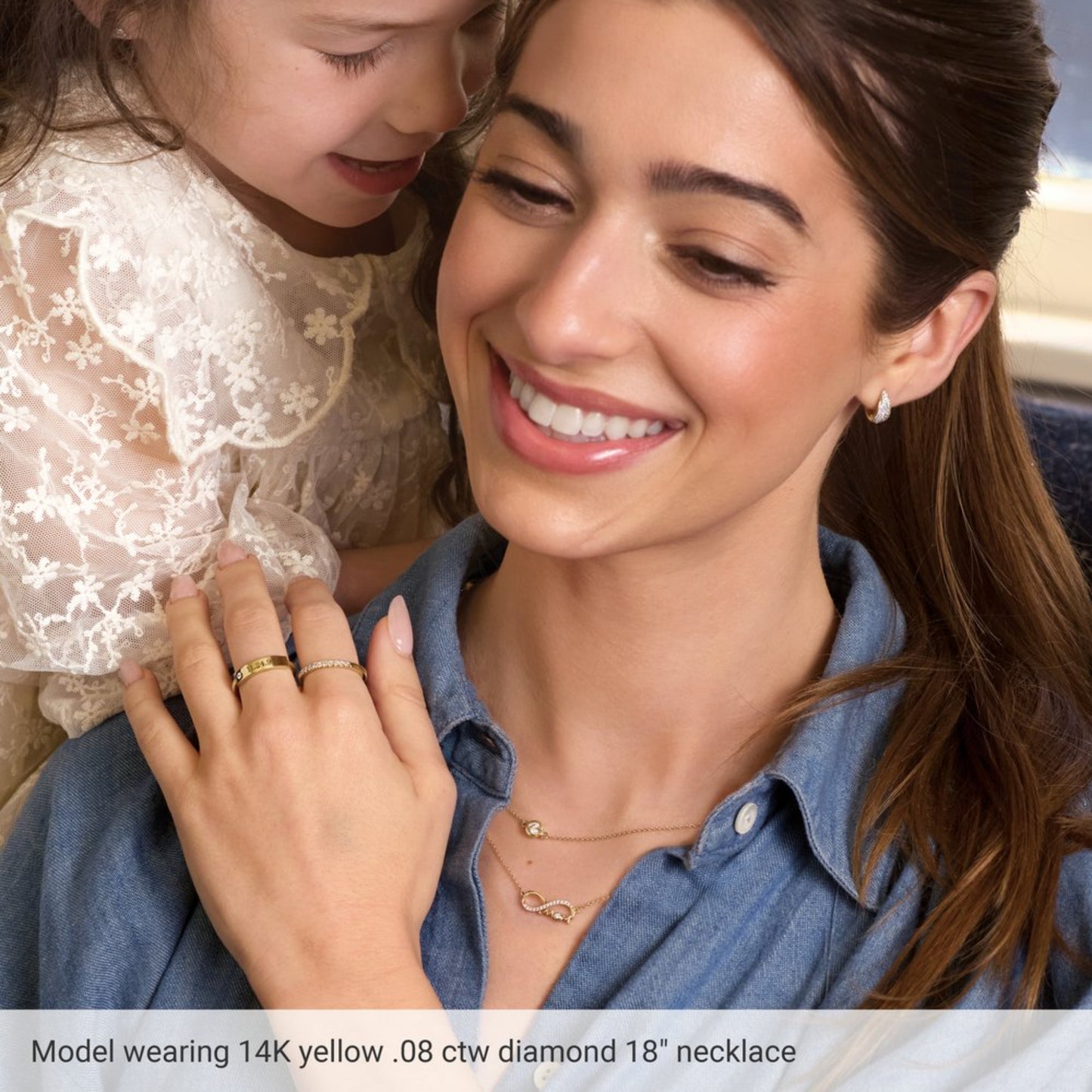 Woman wearing a necklace with a child on her shoulders, with text about a diamond necklace.